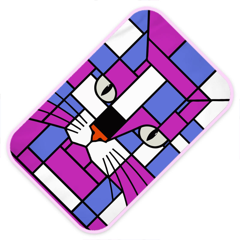 A rectangular mat with rounded corners featuring a colorful stained-glass style cat face design in purple, blue, white, black with a light pink border, shown on a plain white background.