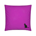 A square magenta pink throw pillow featuring a small black silhouette of a sitting cat in the bottom right corner, set against a plain white background.