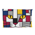 A rectangular throw pillow featuring a stylized cat face in a geometric, Piet Mondrian-inspired block pattern with yellow eyes, on a solid white background.