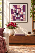 A stylized geometric cat face artwork made of pink, purple, white, black, and orange blocks with black grid lines.