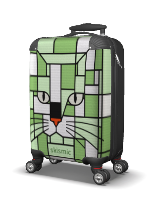 A hard-shell spinner suitcase with a green and white geometric cat face design, featuring the brand name 'skismic' near the bottom, shown on a white background.