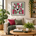 A stylized geometric cat face artwork made of pink, sage green, white, black, and orange blocks with black outlines, centered on a white background.
