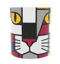 A white ceramic mug featuring a carnival coloured geometric cat face design in red, gray, black, yellow, and white.