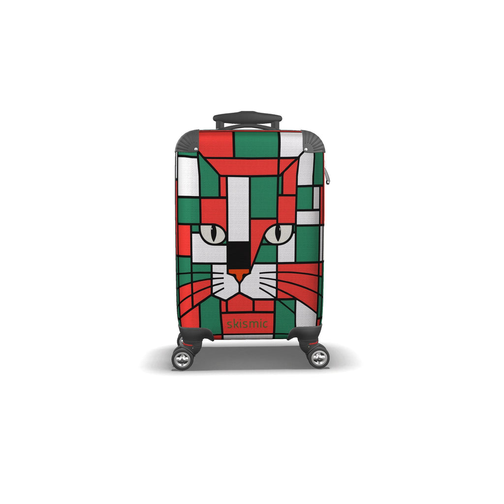 A hard-shell spinner suitcase featuring a colorful geometric cat face design in red, green, white, and gray, with the skismic logo near the bottom.